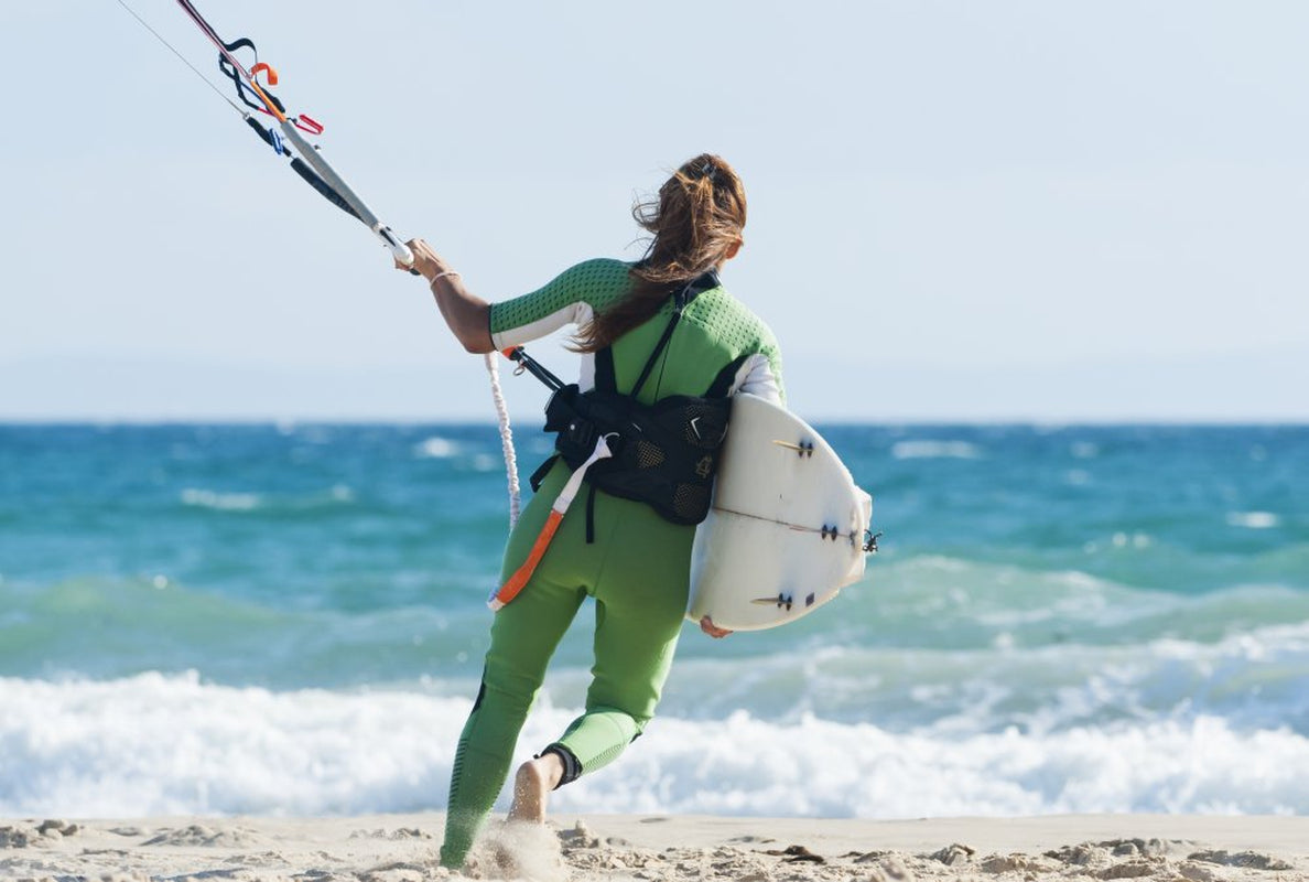 A Woman with Her Kitesurfing Board Walking into the Water; Tarifa, Cadiz, Andalusia, Spain Poster Print (19 X 12)